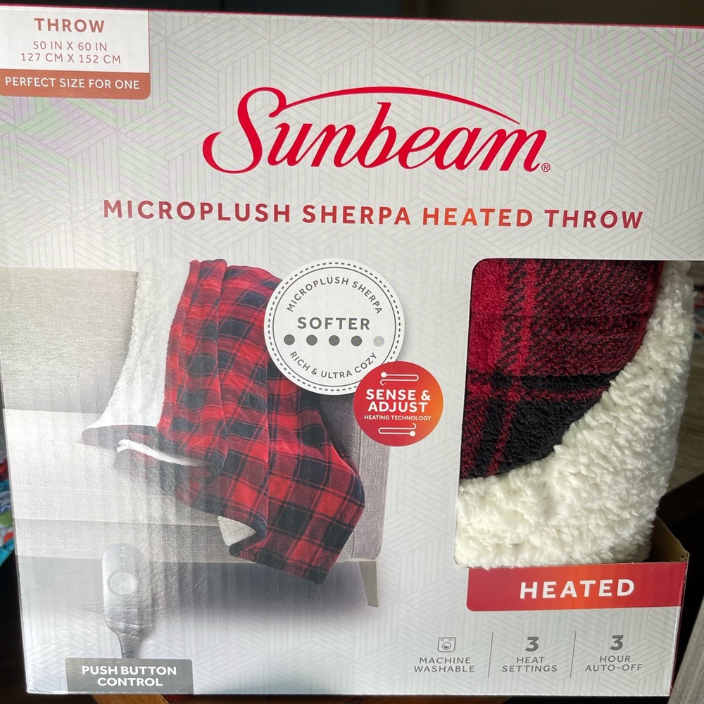 Sunbeam 50” by 60” NEW Sherpa heated blanket. Never been taken out of the box.